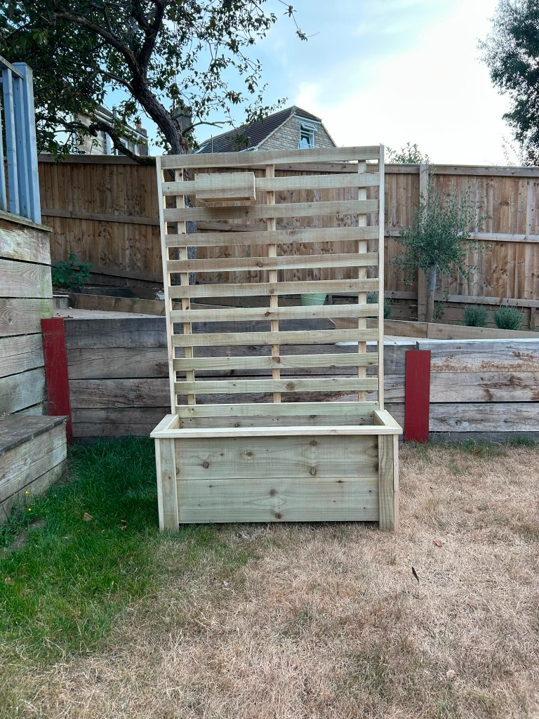 Handmade wooden planter box with privacy board